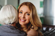 © InsideCreativeHouse - Head shot of happy young woman hugging old senior mother