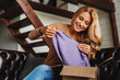 © InsideCreativeHouse - Smiling middle aged woman customer receive parcel at home, online shopping order delivery concept