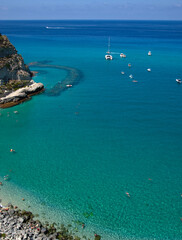 Wall Mural - Sea beach with turquoise water and sand where people relax