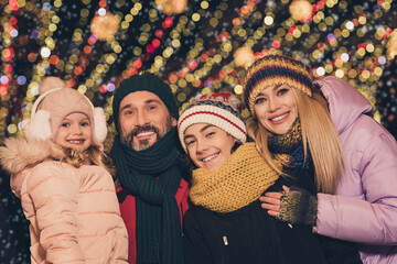 Poster - Portrait of attractive cheerful careful family having fun visiting festal international fair shopping city urban outdoors