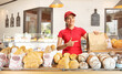 © Ljupco Smokovski - Female baker holding a paper bag in a bakery
