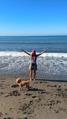 Wall Mural - It was a joyful day at the beach, enjoying the sun with my dog, making memories together