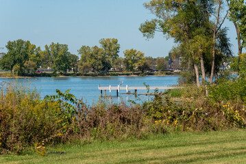 Wooden Boat Dock Stretching Out Into The Waters Of Fox River In De Pere, Wisconsin, In Fall