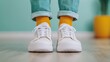 © Arthur Constantine - Stylish Sneakers with Bright Yellow Socks in a Room