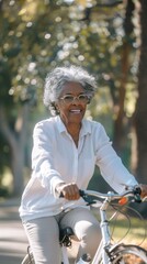 Poster - A woman is riding a bicycle in a park