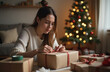 © Marina - Tired mom wrapping Christmas gifts for children by the holiday tree