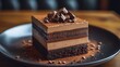 © Jack - A rich chocolate cake with layers of chocolate mousse and chocolate ganache, elegantly garnished with cocoa nibs.