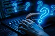 © DWN Media - Question marks floating above the hand of someone typing on their computer, glowing blue outline, dark background, high contrast