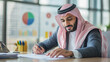 © webcesastock - Uomo d'affari Arabo fa conti di business e trading