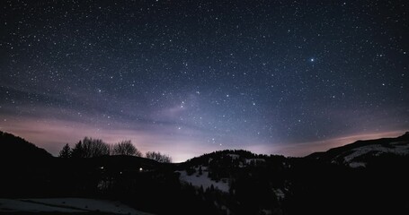 Wall Mural - magic winter night sky with stars of milky way galaxy motion fast before sunrise time lapse astronom