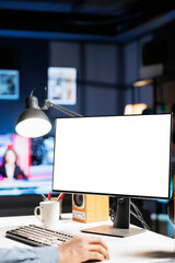 Remote worker looking at white template on pc monitor, sitting at home and using empty computer layout screen. African american freelancer checks isolated blank display at his workstation.