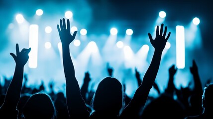 Canvas Print - A crowd of people are at a concert, with their hands raised in the air