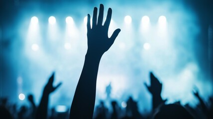 Sticker - A hand is raised in the air at a concert