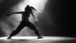 © musa - A female dancer with dreadlocks performs a hip hop dance move in a spotlight.