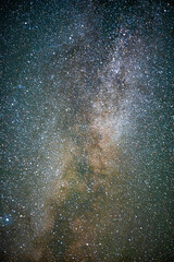 space with galaxy . milky way on the blue sky .dark and cold night at summer . trees on the backgoun