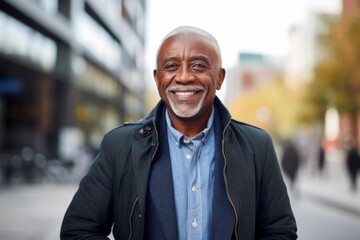 Smiling portrait of a senior casual African American businessman in city