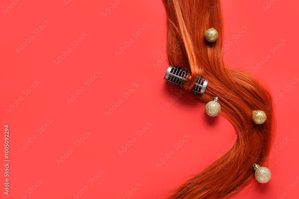 Ginger hair with curler and Christmas balls on red background
