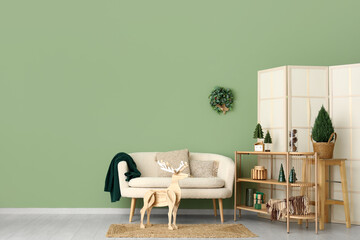 Wall Mural - Interior of living room decorated for Christmas with sofa and shelf unit