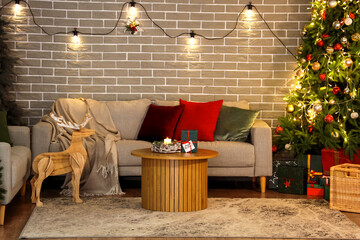 Poster - Interior of festive living room with Christmas tree, wooden deer and glowing lights