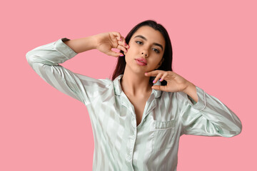 Sticker - Beautiful young woman in stylish pajamas on pink background