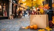 © Mumtaz - Shopping Bag with Autumn Leaves and Pumpkins in City Street