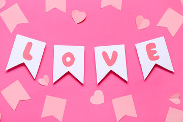 Wall Mural - Paper flags with word LOVE and hearts on pink background. Valentine's Day celebration