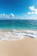 Ocean waves breaking on sand at tropical beach for vertical background