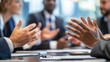 © putri syakilla - A group of professionals engaged in discussion during a meeting.