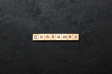 consumer word written on wood block. consumer text on table, concept