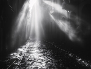 black and white moody alleyway with light rays in foggy city scene