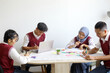 © Gatot - High School Students Doing School Work Together at The Study Room