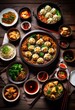 © Yaraslava - lively display colorful delicious chinese dishes including stir fried meals, cuisine, dumplings, noodles, sauces, herbs, vegetables, meats, rice, seafood