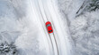 © Ivan - Aerial drone above top view of a car driving on a snow mountain road near the sea, winter forest landscape with ice and frost. Vacation concept, travel by car. Space for text or design. Generative AI.