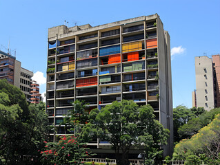 Wall Mural - abstract angles and curves of modernist architecture in caracas, venezuela, under a cloudy sky.