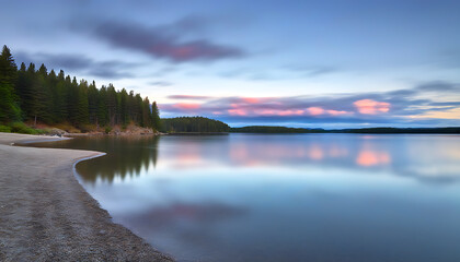 Wall Mural - Beautiful sunset over a serene lake with natural scenery and interplay of light and shadow.