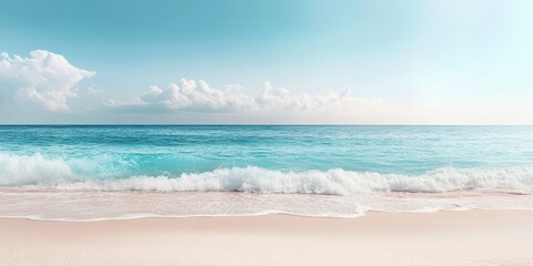 Wall Mural - A serene beach scene with soft waves lapping at a smooth sandy shore under a bright blue sky with fluffy clouds.