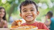 © Sweettymojidesign - Happy child enjoying pizza outdoors in a vibrant setting.