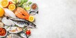 © kiimoshi - Fresh seafood assortment with citrus fruits and herbs on a light background, perfect for culinary and health-related projects.