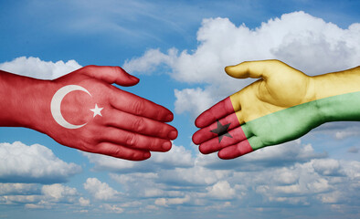 Guinea-Bissau and Turkey country handshaking with flags, consensus concept international co-operation illustration