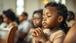 © abu - Small African American child praying in a peaceful church setting.