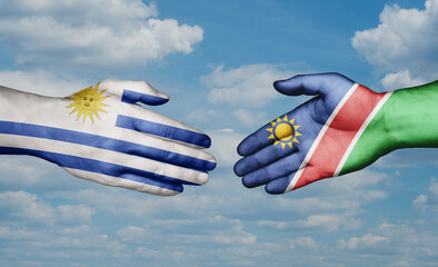 Namibia and Uruguay country handshaking with flags, consensus concept international co-operation illustration