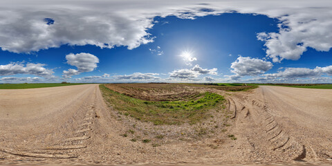 Wall Mural - spherical 360 hdri panorama on roadside of gravel road with rain storm clouds in thunderstorm front dark sky in equirectangular seamless projection, as skydome replacement in drone panoramas