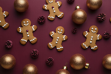 From a bird's-eye view, display a charming arrangement of gingerbread men cookies on a dark raspberry background, accented by shiny gold Christmas ornaments, creating a rich and inviting holiday