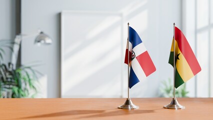 FLAGS OF DOMINICAN REPUBLIC AND GHANA ON TABLE