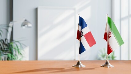 FLAGS OF DOMINICAN REPUBLIC AND IRAN ON TABLE