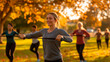 © Iryna - Women are engaged in functional training in the park on a sunny autumn day during an outdoor fitness class