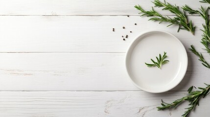 Fresh and dried rosemary sprigs are artfully arranged on a whitewashed wooden table, with a small ceramic dish at the center, allowing for creative text placement