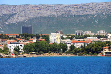 Contemporary buildings, gardens and beaches at the waterfront in Split, Croatia. View of Split from the boat.