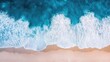 © Pannin - Beautiful top view of the sea, where azure waves create intricate patterns with white foam, highlighting the mesmerizing rhythm of nature and coastal life.