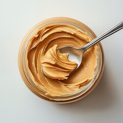 Canvas Print - A spoonful of peanut butter in a glass jar.